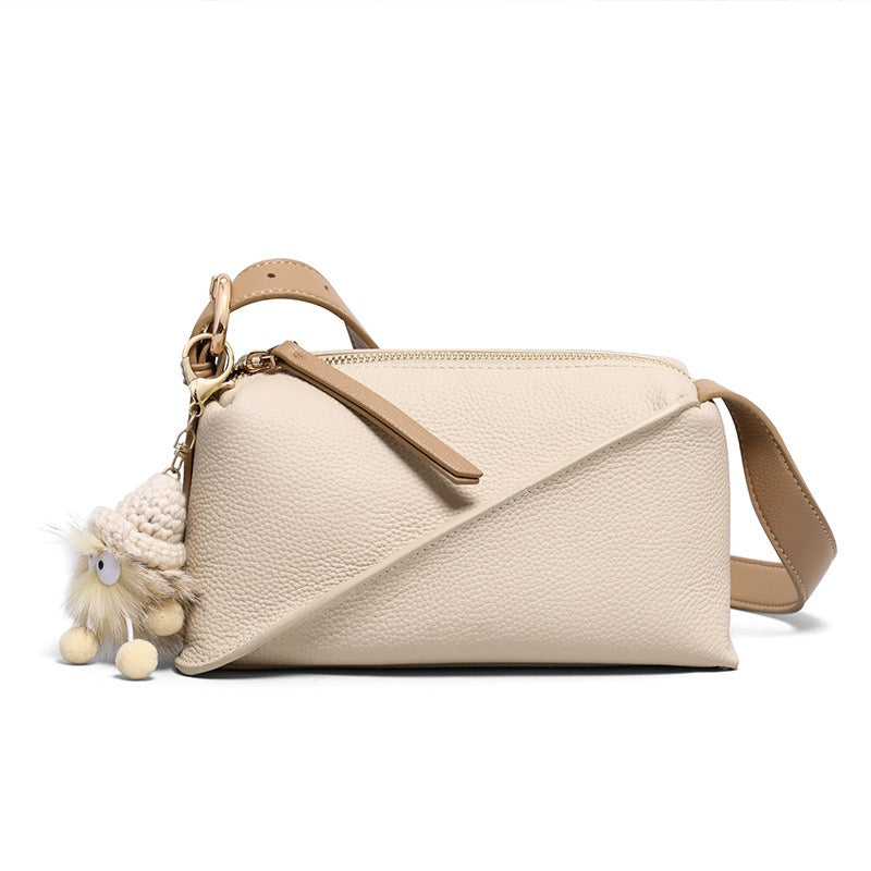 Elegant Geometric Genuine Leather Crossbody Bag with Plush Charm